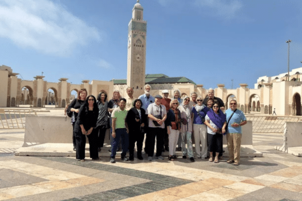 Travel group visiting the Hassan II Mosque in Casablanca during a Morocco tour.